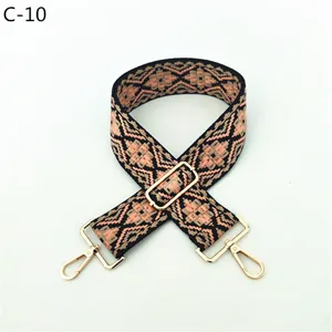 Ethnic style jacquard replacement bag strap with adjustable buckle and gold hardware.