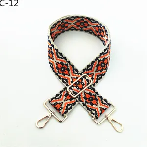 Ethnic style woven replacement bag strap with adjustable metal buckles and snap hooks.