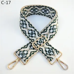Ethnic style jacquard bag strap replacement, beige and dark green pattern with gold metal hardware.