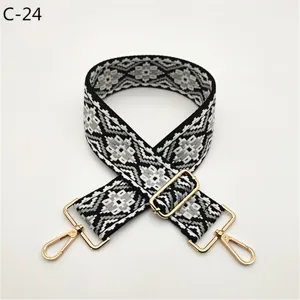 Replacement black white ethnic jacquard bag strap with gold metal adjustable buckles.