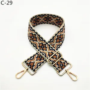 Ethnic jacquard bag strap detail, adjustable woven replacement strap with gold hardware.
