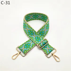 Ethnic style woven replacement bag strap with adjustable length and golden metal hardware details.