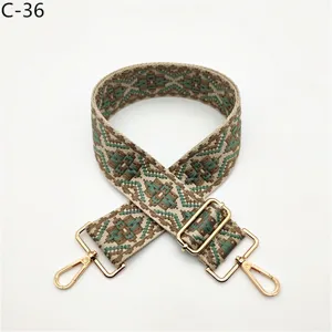 Ethnic style woven bag strap replacement with adjustable gold metal hardware and hooks.