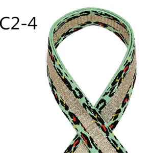 Ethnic style jacquard webbing detail shot, green and gold leopard polyester ribbon.