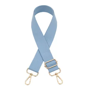 Solid color light blue replacement bag strap with adjustable gold hardware for crossbody bags.