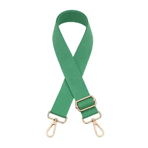 Green adjustable replacement bag strap detail, canvas material with gold metal hardware hooks.