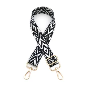 Replacement black and white woven bag strap with gold metal hardware, adjustable for crossbody bags.