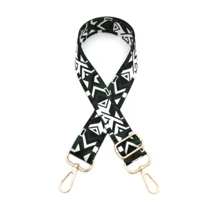Adjustable wide bag strap replacement with geometric pattern and gold hardware for use.