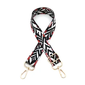 Woven replacement bag strap with black, white and red geometric pattern and gold hardware.