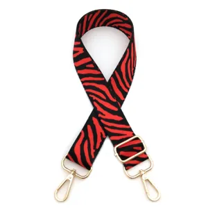 Red and black striped replacement bag strap with adjustable gold metal hardware.