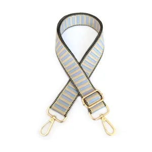 Ρυθμιζόμενος ιμάντας τσάντας ζακάρ ανταλλακτικός με ριγέ υφασμάτινο ιμάντα και χρυσές λεπτομέρειες.
