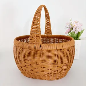 Detailed view of brown woven picnic storage basket with handle, ideal for home and garden decor.