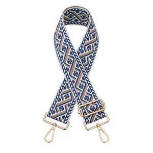 Sangle de sac large de rechange avec motif jacquard géométrique bleu et beige, accessoires dorés.