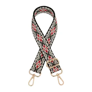 Adjustable woven bag replacement strap detail, ethnic geometric pattern with gold hardware.