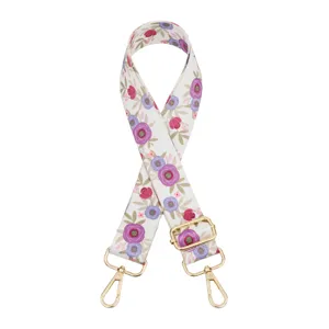 Floral print replacement bag strap detail, adjustable canvas strap with gold metal hooks.