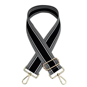 Ancha correa de bolso de repuesto en blanco y negro con herrajes dorados ajustable.