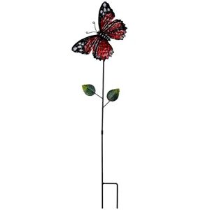 Close up view of the metal butterfly garden stake detail showing vibrant red and black wings.