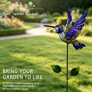 Metal hummingbird garden stake with vibrant stained glass wings for outdoor yard decoration.