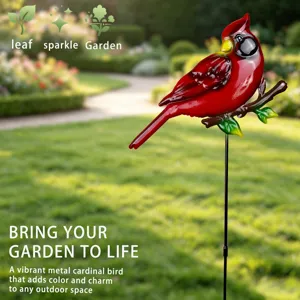 Detailed view of metal red cardinal bird garden stake, vibrant outdoor lawn decor.