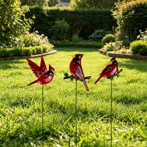Detailed view of metal red cardinal garden stakes, perfect for outdoor lawn and courtyard decor.