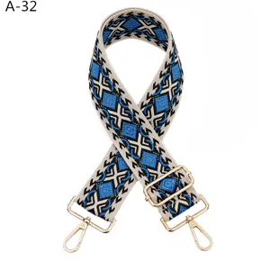Adjustable replacement bag strap with geometric diamond pattern and gold hardware.