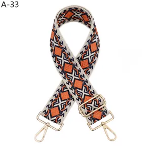 Adjustable replacement bag strap with geometric diamond pattern and gold-tone hardware details.