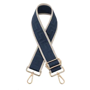 Vue détaillée d'une lanière de sac de rechange avec motif géométrique bleu et boucles dorées