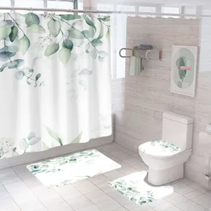 Watercolor eucalyptus bathroom set including shower curtain, toilet mat, and floor rugs.