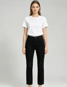 Detailed shot of women slim fit ripped cropped black jeans and white t-shirt casual wear.