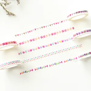 Detailed view of colorful decorative washi tape showing various cute patterns for crafts.