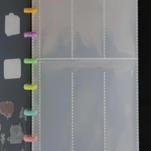 Detailed view of clear 3-inch photocard binder with colorful mushroom hole rings and pockets.