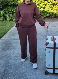 Casual brown fleece hooded sweatshirt and loose wide leg sweatpants two piece tracksuit set.