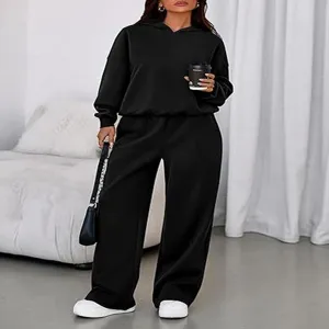 Casual black hooded sweatshirt and wide-leg sweatpants two-piece set, indoor detail shot.
