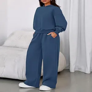 Detail view of the cozy fleece-lined blue hooded sweatshirt and wide-leg pants lounge set.