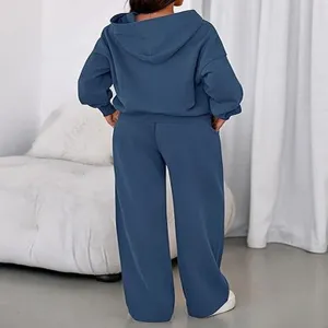 Solid color hooded sweatshirt and wide-leg sweatpants two-piece tracksuit for women.