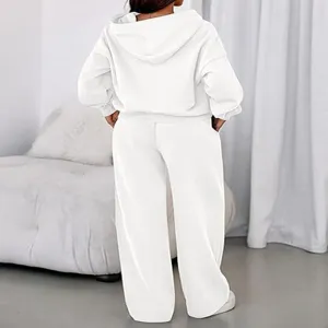 Back detail view of women fleece-lined solid white hooded sweatshirt and loose sweatpants set.