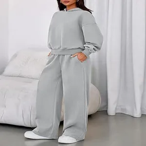 Detailed view of women casual grey hooded sweatshirt and wide leg sweatpants lounge set.
