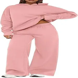 Women solid pink fleece hoodie and wide-leg sweatpants two-piece tracksuit set casual outfit.