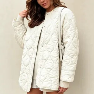Quilted outerwear jacket with round neck and snap buttons in casual style detail shot.