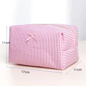 Pink white striped cosmetic makeup bag detail view, dimension display compact toiletry storage pouch.