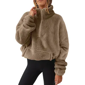 Close up view of the cozy plush half-zip stand-collar sweatshirt featuring soft fleece.