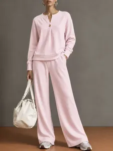 Pink V-neck long sleeve sweatshirt and wide leg pants loungewear set for women casual wear.