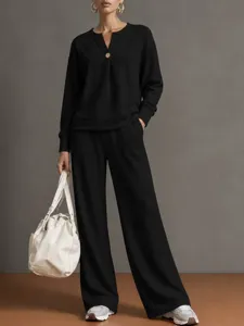 Casual two piece set long sleeve sweatshirt wide leg pants detail view style comfortable outfit.
