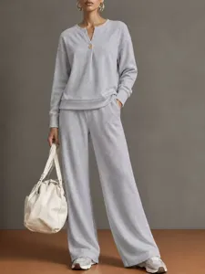 Casual grey V-neck long sleeve sweatshirt and wide leg pants lounge set detail view.