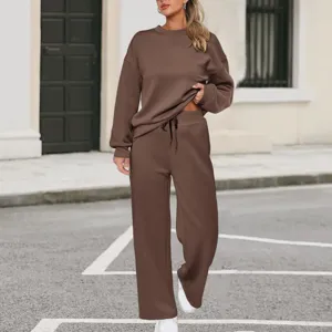 Women knit two-piece set featuring long sleeve sweatshirt and casual wide leg pocket pants.