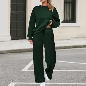 Dark green knit two-piece tracksuit detail, long sleeve sweatshirt with wide leg trousers.