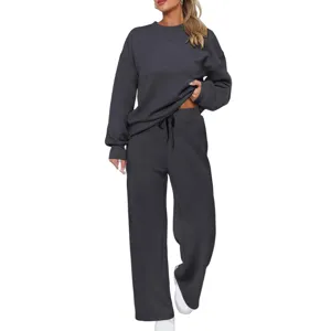 Detailed view of the cozy dark grey knit sweatshirt and wide leg pants set, showcasing texture.