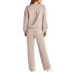 Detailed back view of women's beige knit two-piece lounge set with long sleeves and pants.