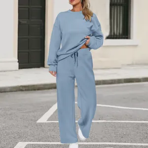 Comfortable light blue knit two piece tracksuit with long sleeve sweatshirt and wide leg pants.
