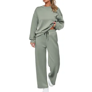 Women's sage green two piece lounge set with crewneck sweatshirt and wide leg pants